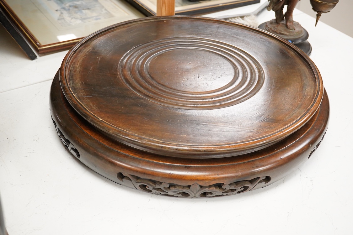 A pair of large Chinese hardwood vase stands, 51cm in diameter